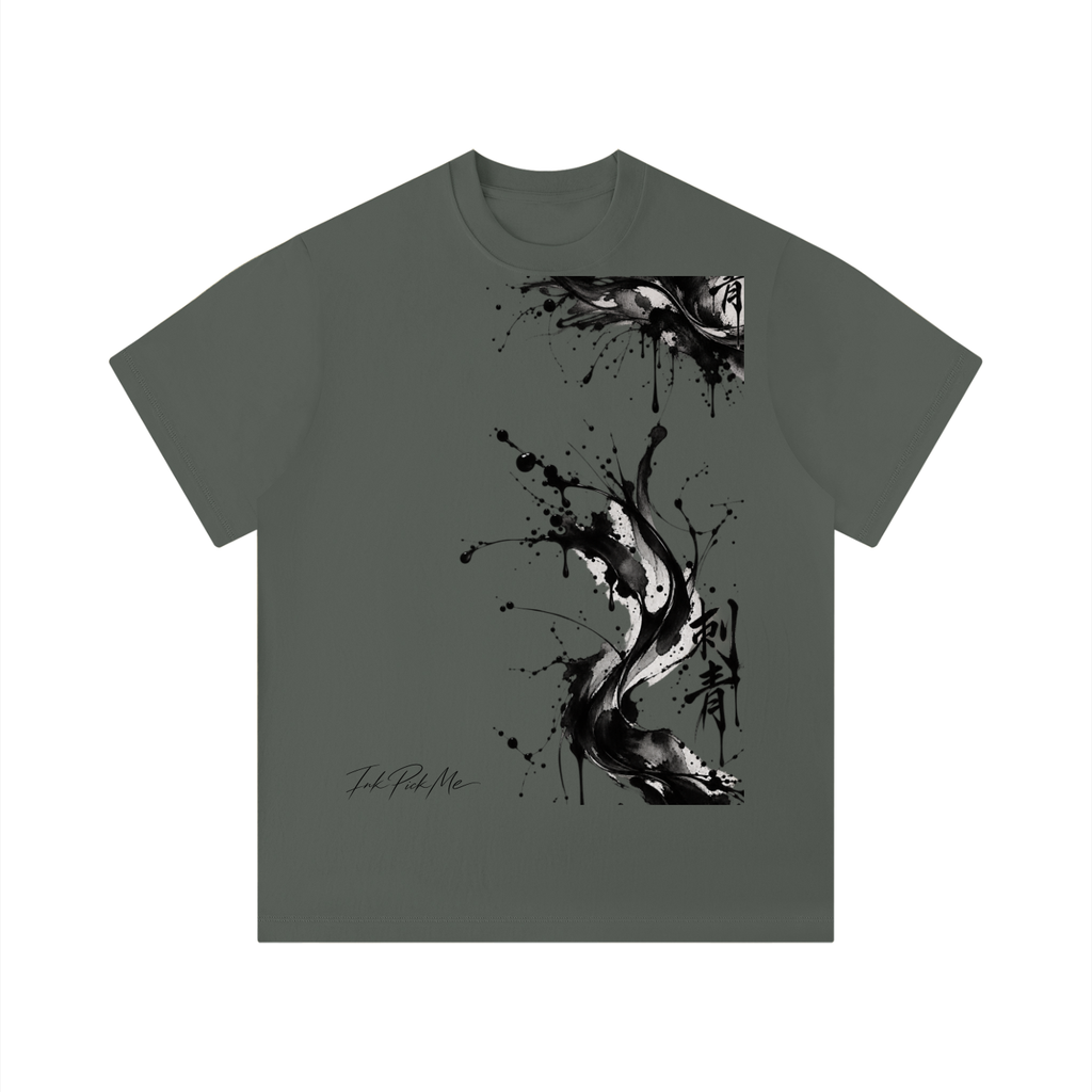 Solid dark green unisex t-shirt featuring a black ink splatter graphic design on the front and a classic round neckline.