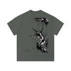 Solid dark green unisex t-shirt featuring a black ink splatter graphic design on the front and a classic round neckline.