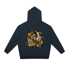 Oversized dark hoodie with a drawstring, featuring a gold graphic of a Daruma doll and the text "FALL RISE REPEAT" on the back.