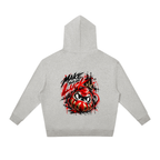 Gray unisex oversized hoodie featuring a colorful Daruma graphic, with "MAKE YOUR OWN LUCK" text on the back.