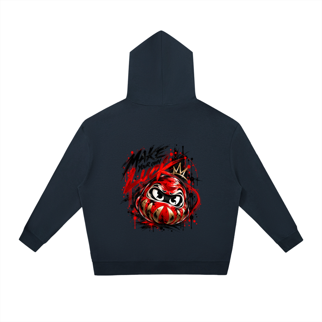 Unisex oversized hoodie in navy featuring a colorful Daruma design and "MAKE YOUR OWN LUCK" graphic on the back.