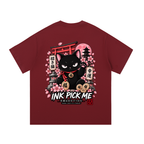 Maroon unisex T-shirt featuring a graphic of a black cat with a red collar, surrounded by sakura and lucky symbols.