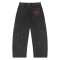 Snow Wash Drawstring Cotton Pants in a faded black color with side pockets and elastic waistband, featuring a logo on the back.
