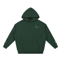 Hoodie Rester soi Ink Pick Me vert foncé, petit motif côté cœur – vue de face