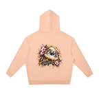 Peach oversized hoodie featuring a Daruma graphic with flowers and "Love Purity" text on the back.
