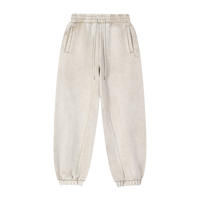Détail du tissu et cordon du pantalon jogging ample.