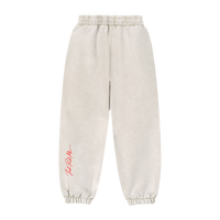 Pantalon jogging ample plié avec motif arrière visible.