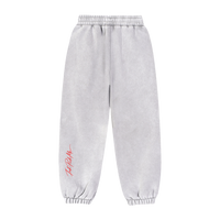 Zoom sur la ceinture et les finitions du jogging ample.