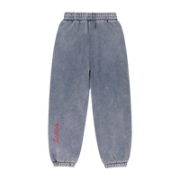 Détail de l'imprimé signature à l'arrière du jogging ample.