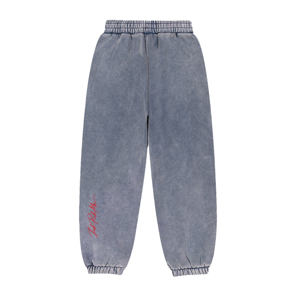 Détail de l'imprimé signature à l'arrière du jogging ample.