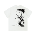 Oversized white t-shirt featuring black abstract ink splatter design and a rounded neckline.
